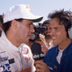 PHOENIX, AZ - APRIL 12, 1987: Broadcaster Jack Arute interviews Roberto Guerrero following his victory in the Checker 200 CART Indy Car race at Phoenix International Raceway.